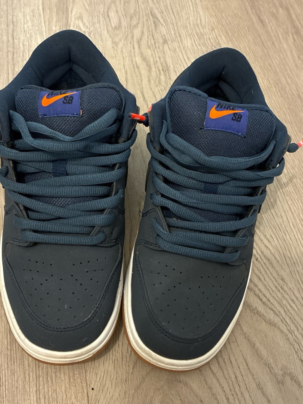 Nike Men’s Navy Sneakers with Orange Logo Accents